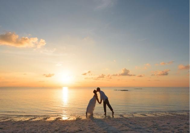 Romantic couple at sunset on the beach.